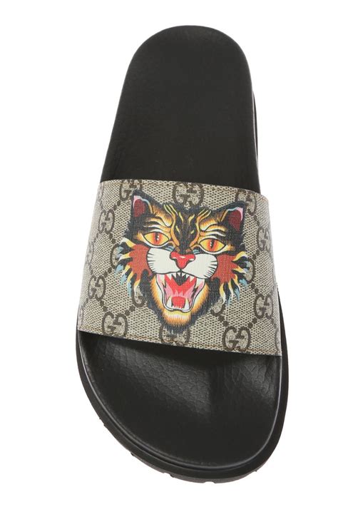 gucci black sneakers tiger|Gucci tiger head slides.